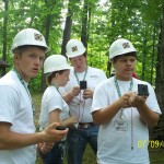 Tucker, Hannah, Caleb and Logan practice using compasses.