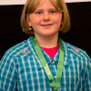 Hannah Herman proudly displays the gold medal she won with her 4-H presentation at the state competition, June 24, 2013, at NC State University