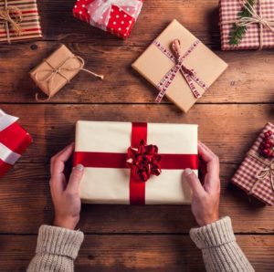 Man holding Christmas presents