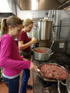 Gage family preparing food for 4-H Achievement Night