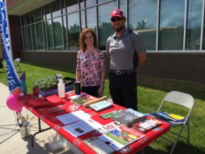 Cooperative Extension staff members Hannah Worrell and Steve Pettis promote Extension at a local event.