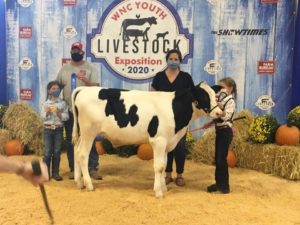Molly Cowan with her family and her dairy steer