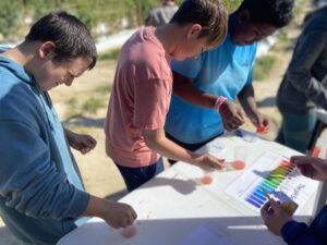 Students inspect PH balance.