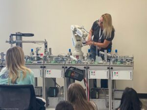 A woman uses lab equipment.