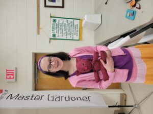 Young person holding a stuffed animal