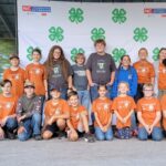 club in front of 4-H backdrop