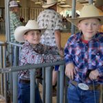 children wearing cowboy hats