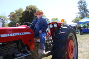 A man sits on a tractor.