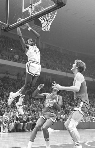 David Thompson scores over Bill Walton in 1974 NCAA Basketball Tournament semifinals.