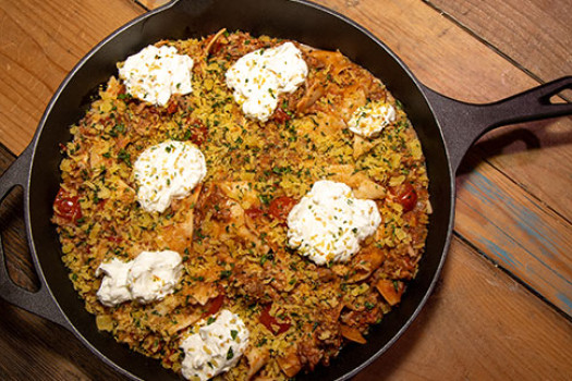 A skillet of rice and zucchini.